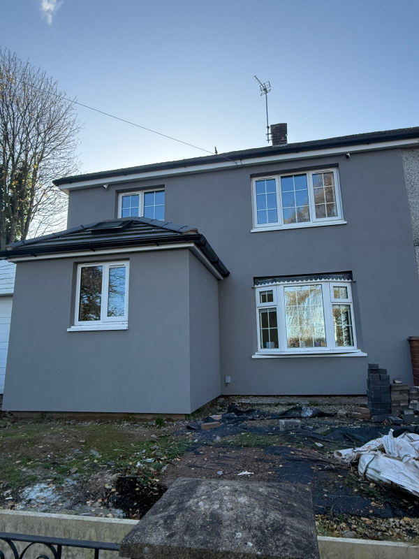 E W I render system to a concrete pour system home with no cavity